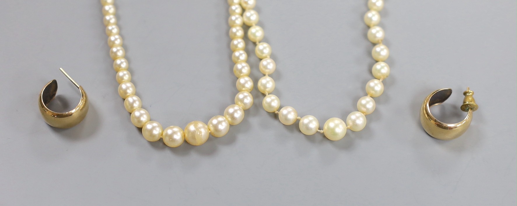 A single strand cultured pearl necklace, with 9ct clasp, 54cm, a simulated pearl necklace and a pair of modern 9ct gold earrings, gross 3.1 grams